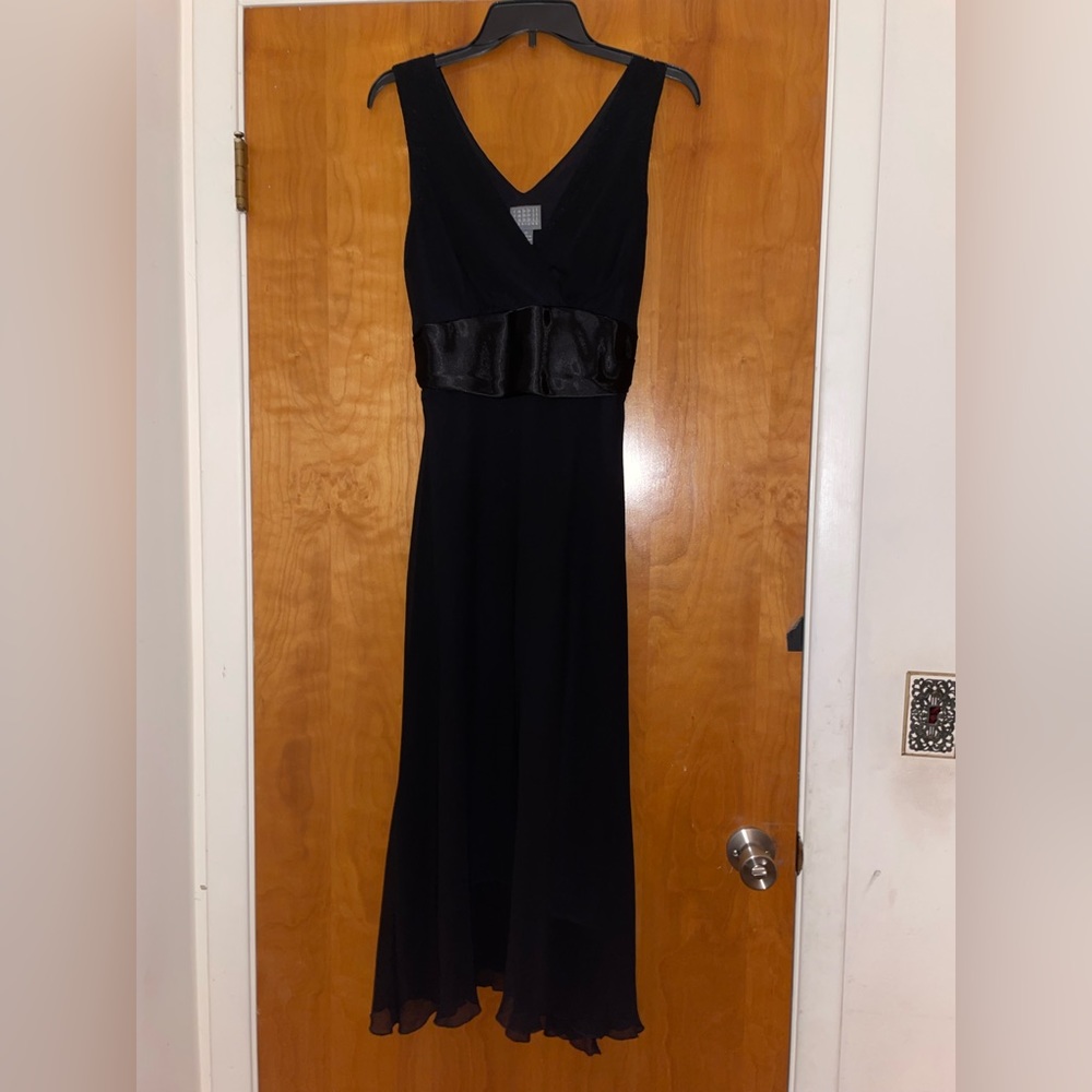 Long black dress that ties in back. About shin length